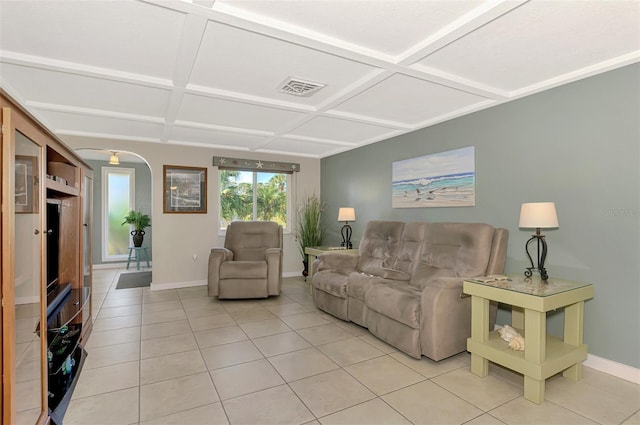 living room featuring light tile patterned flooring and coffered ceiling