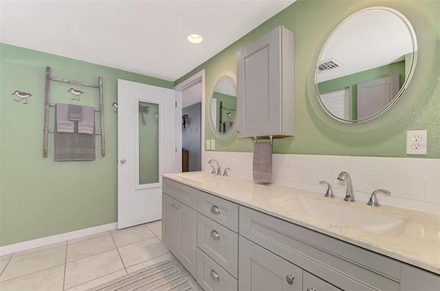 bathroom with tile patterned floors and vanity