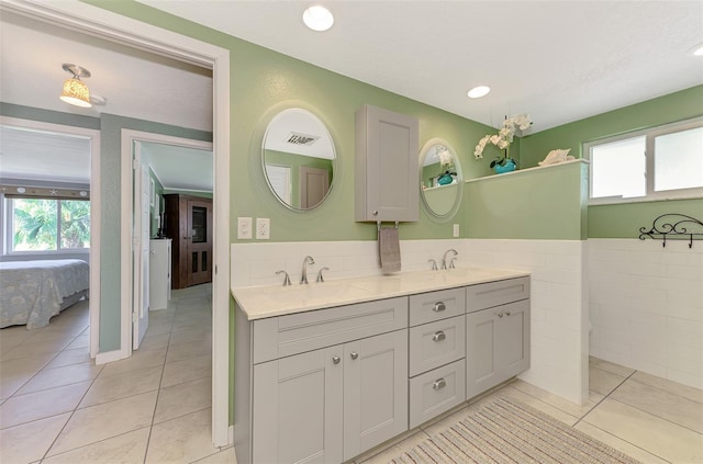 bathroom with tile patterned floors and vanity