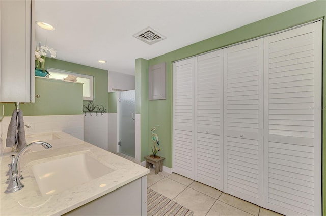 bathroom featuring tile patterned floors and vanity