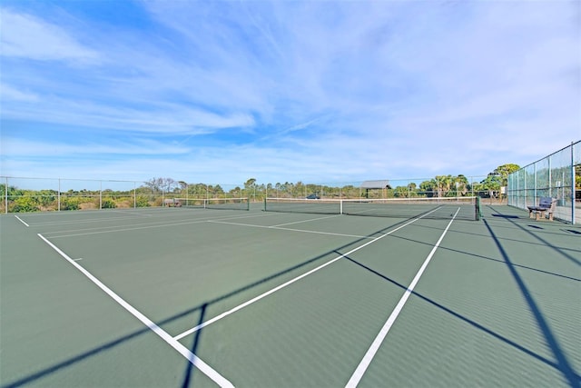 view of sport court with basketball hoop