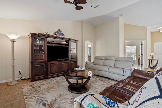 tiled living room with vaulted ceiling and ceiling fan