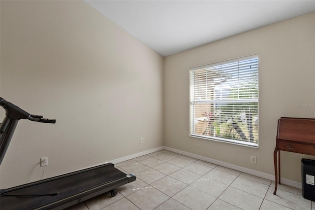 workout area featuring light tile patterned floors