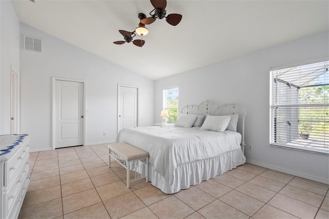 tiled bedroom featuring high vaulted ceiling and ceiling fan