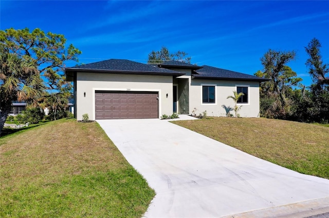 view of front of house featuring a front lawn and a garage