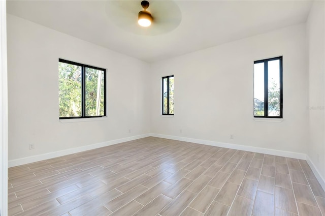 unfurnished room with ceiling fan