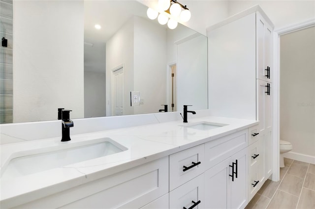 bathroom with vanity and toilet