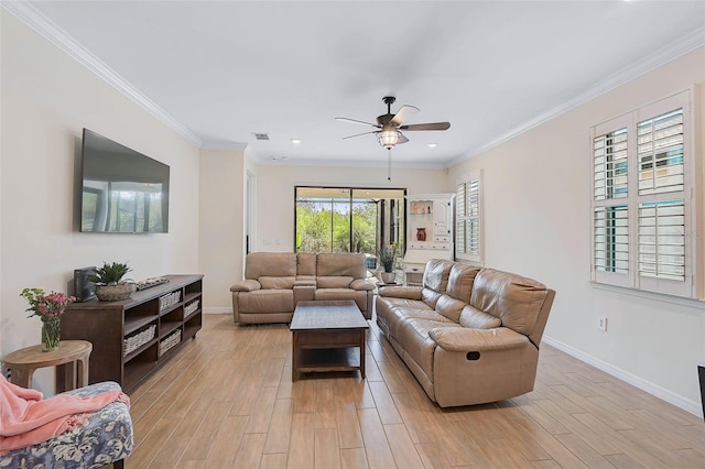 living room with ceiling fan and crown molding