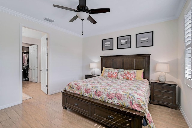 bedroom with ceiling fan and ornamental molding