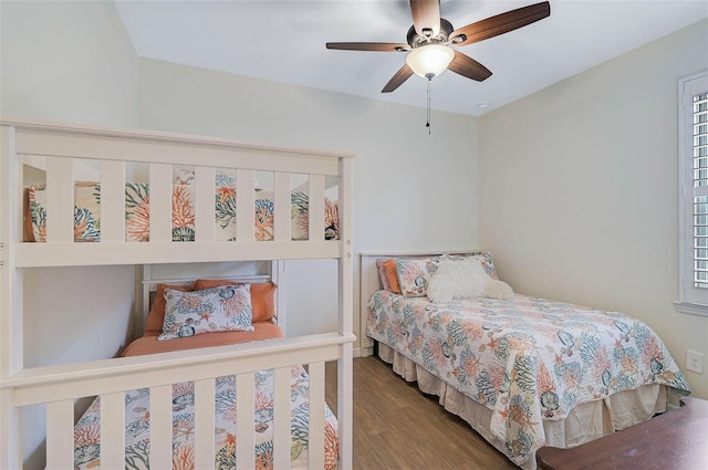 bedroom with ceiling fan and wood-type flooring