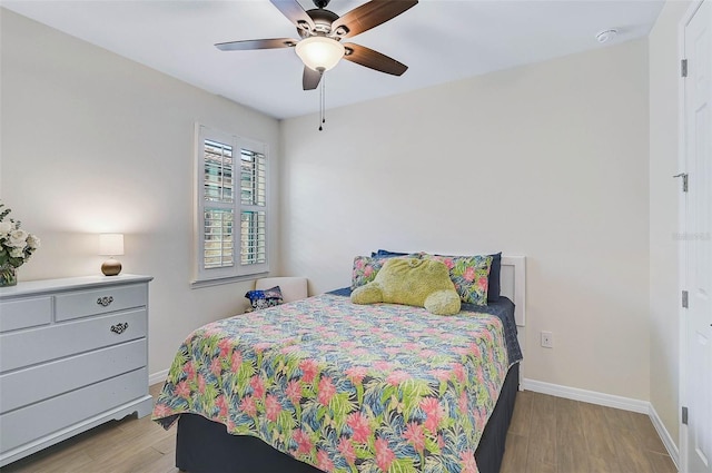 bedroom featuring ceiling fan and light hardwood / wood-style flooring