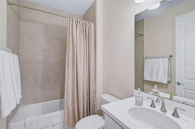 full bathroom featuring toilet, shower / bathtub combination with curtain, and vanity