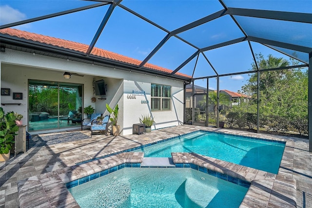 view of pool with a lanai, a patio, and ceiling fan