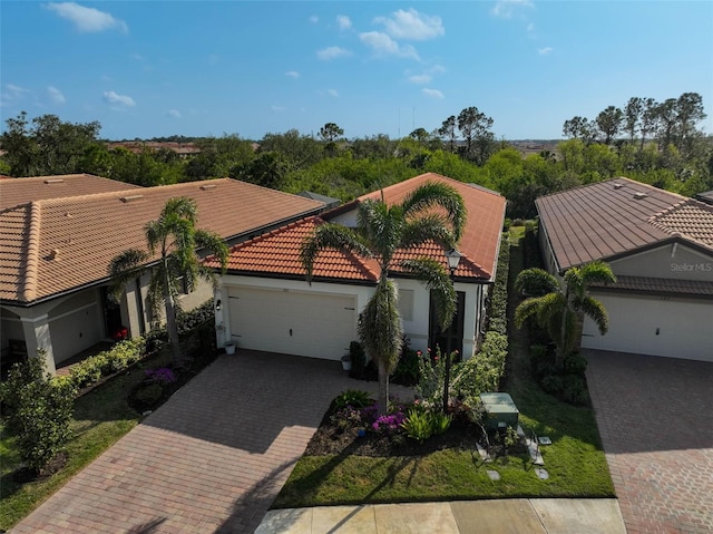 mediterranean / spanish-style home featuring a garage