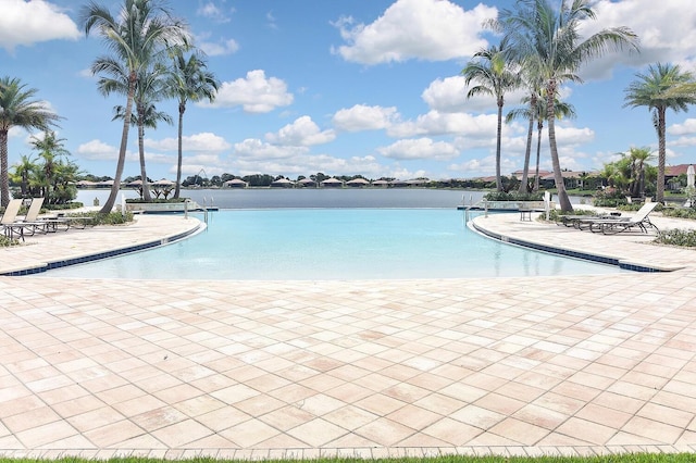 view of pool featuring a water view