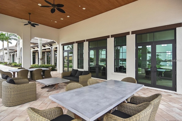 view of patio with ceiling fan and french doors