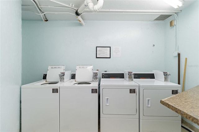 laundry room with washing machine and clothes dryer