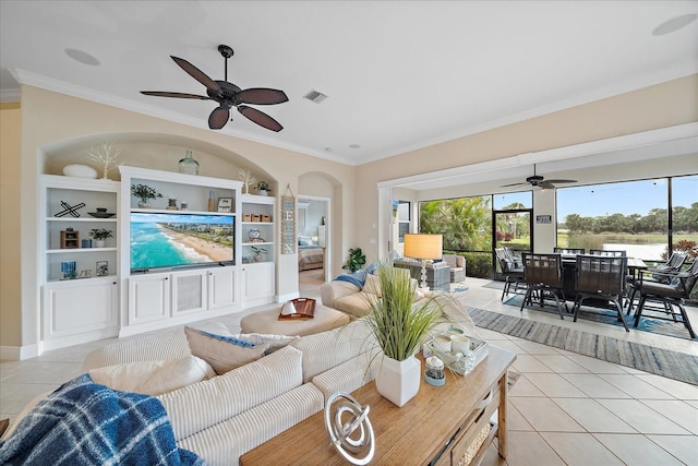 living room featuring ceiling fan, built in features, light tile patterned flooring, and ornamental molding