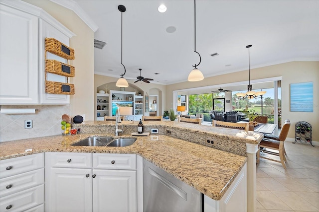 kitchen featuring kitchen peninsula, white cabinets, ceiling fan, and sink