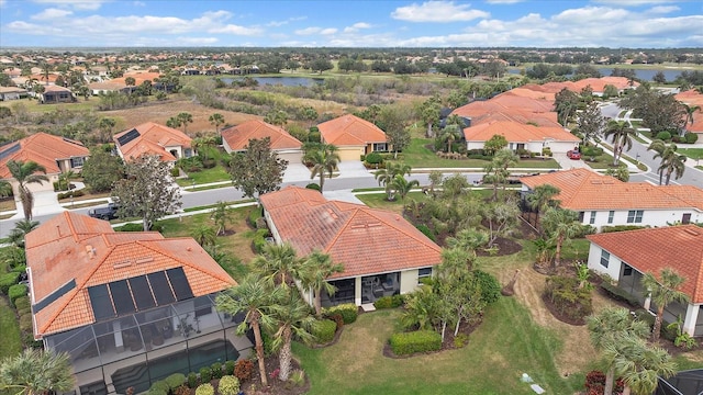 bird's eye view featuring a residential view and a water view