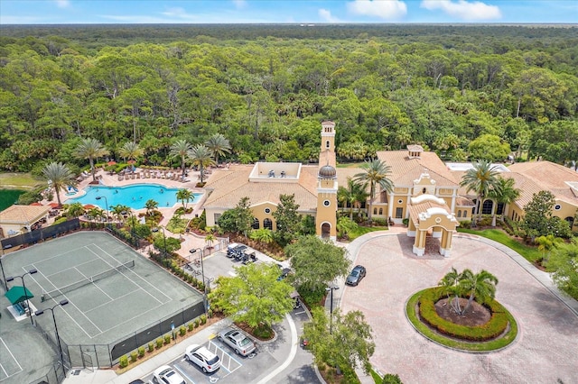 drone / aerial view featuring a forest view