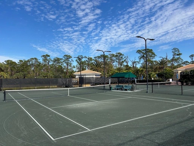 view of tennis court with fence