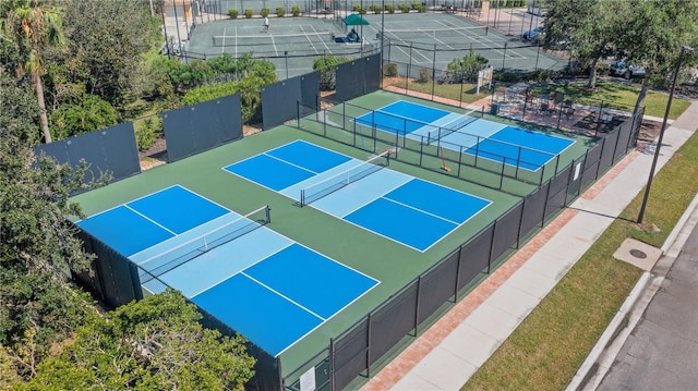 view of sport court featuring fence