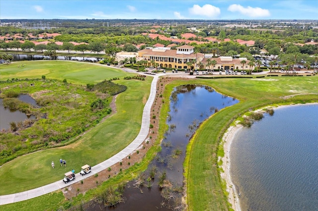 aerial view featuring view of golf course and a water view