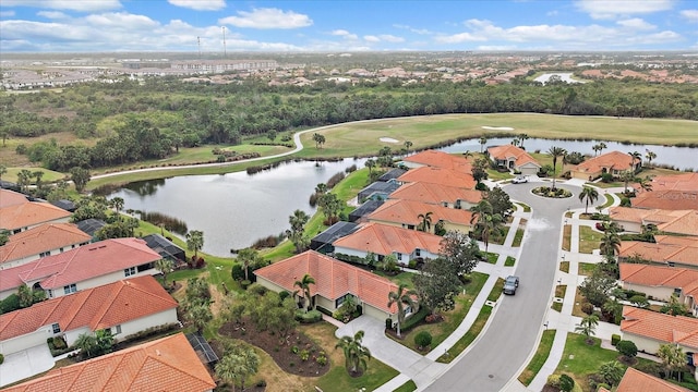 aerial view with a residential view and a water view