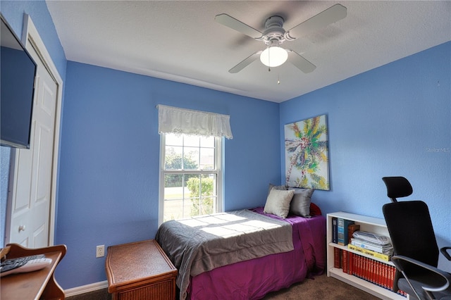 carpeted bedroom with ceiling fan