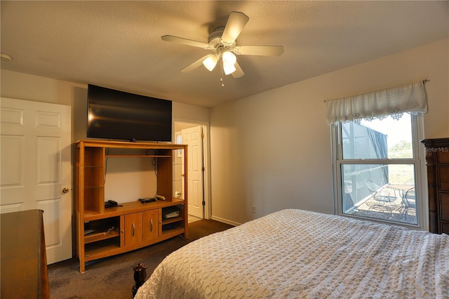 bedroom with dark carpet and ceiling fan