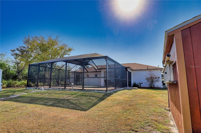 view of yard featuring glass enclosure