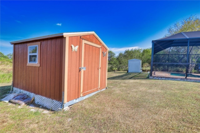 view of outbuilding with a lawn