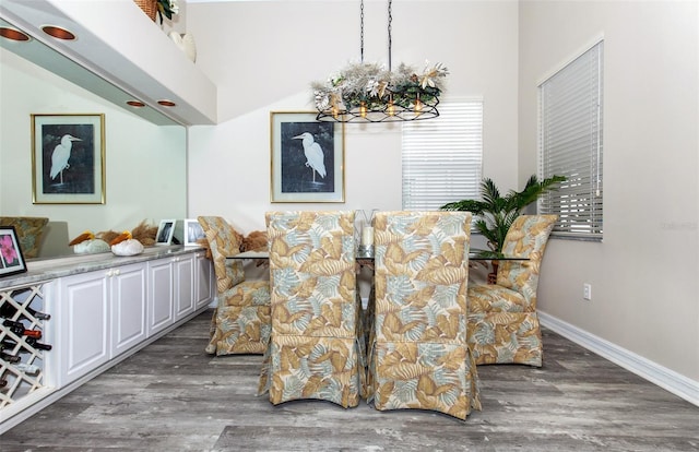 dining space with dark wood-type flooring