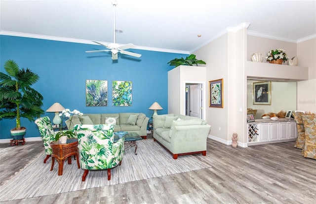 living room with light hardwood / wood-style flooring, ceiling fan, and ornamental molding