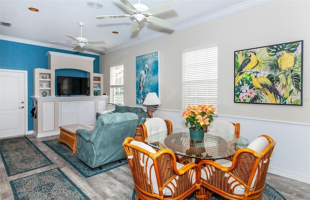 dining room with wood-type flooring and ornamental molding