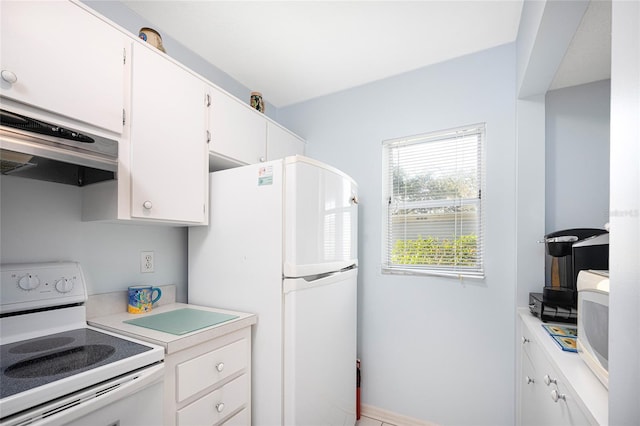 kitchen featuring white cabinets, ventilation hood, and white appliances