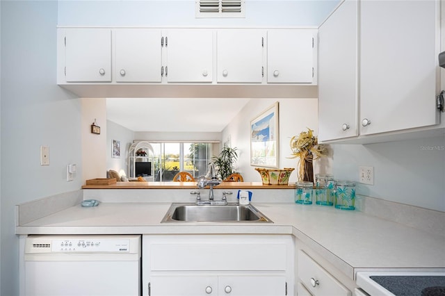 kitchen featuring range, dishwasher, white cabinets, and sink