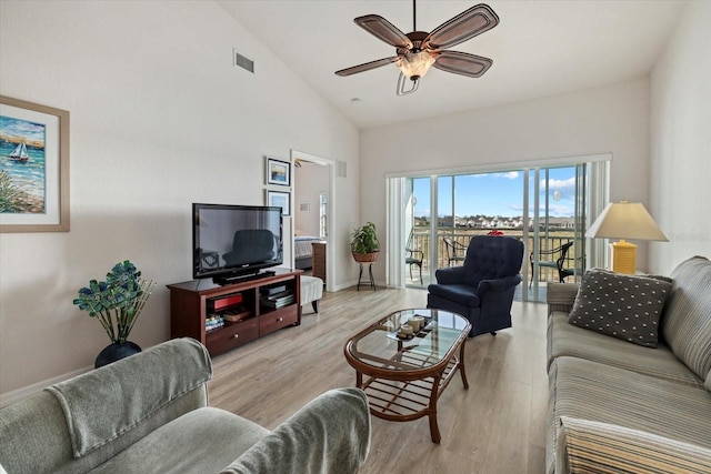 living room featuring high vaulted ceiling, ceiling fan, and light hardwood / wood-style floors