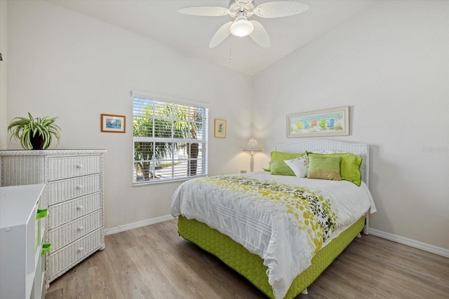 bedroom with ceiling fan and hardwood / wood-style flooring