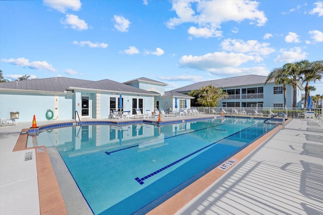 view of swimming pool featuring a patio area