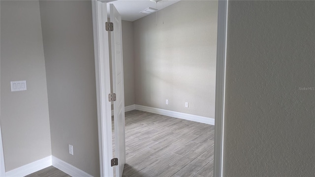 14464 Fort Myers Ave, Port Charlotte, FL 33981 - unfurnished room featuring wood finished floors and baseboards