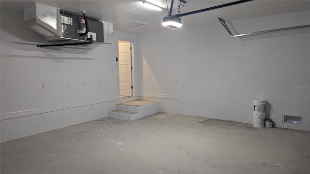 14464 Fort Myers Ave, Port Charlotte, FL 33981 - garage with a garage door opener and a textured wall