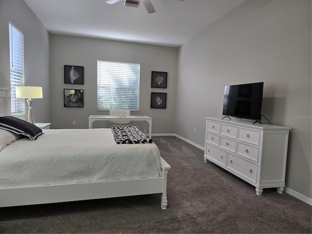 bedroom with ceiling fan and dark carpet