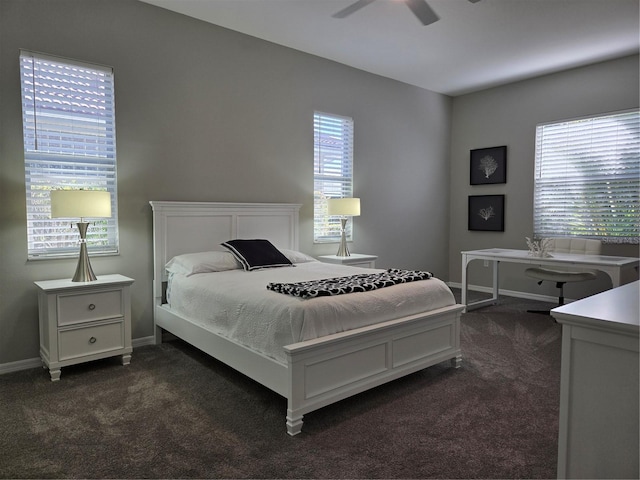 bedroom featuring ceiling fan and dark carpet