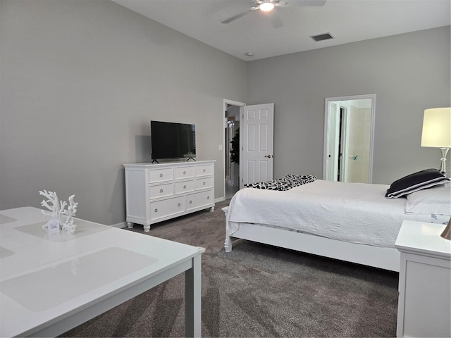 carpeted bedroom with ceiling fan and ensuite bathroom