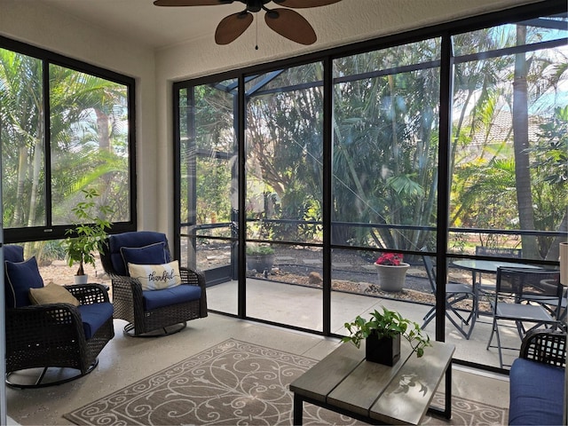 sunroom featuring ceiling fan