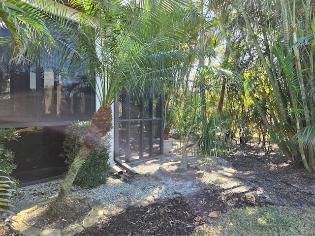 view of yard featuring a sunroom