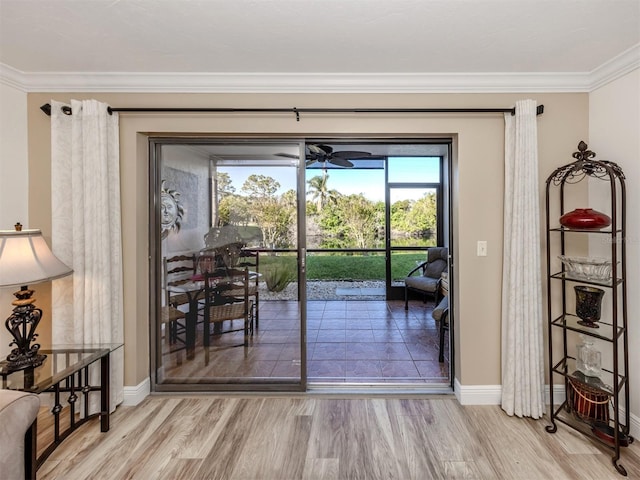 entryway featuring light hardwood / wood-style floors and crown molding