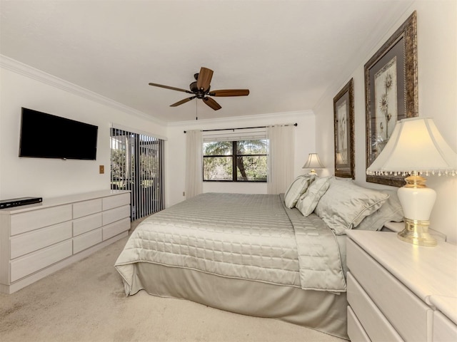 carpeted bedroom with ceiling fan and crown molding